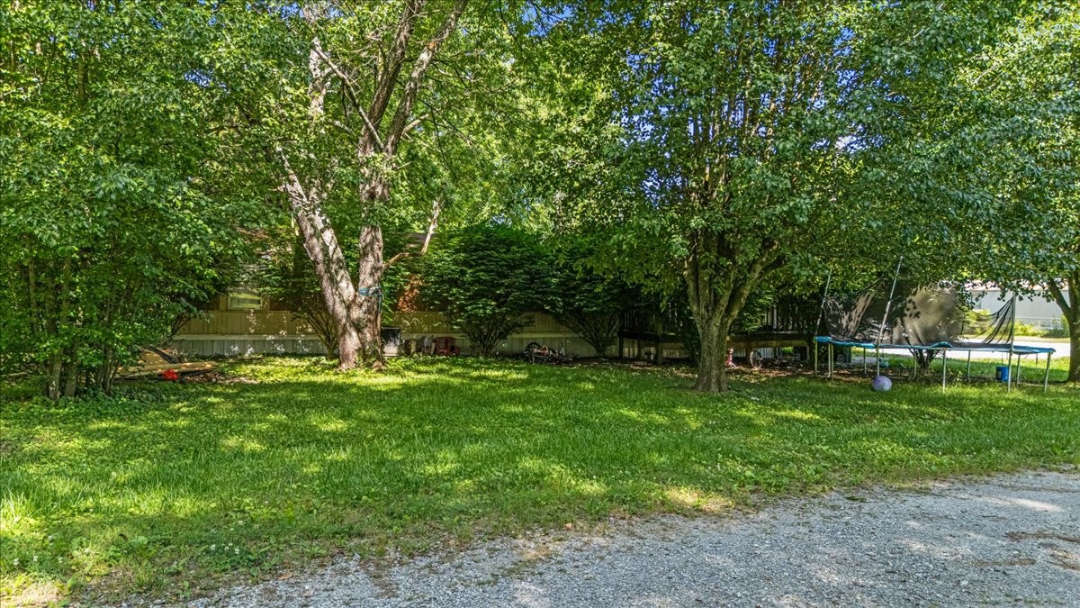 0 Ez Lane Manchester, TN 37355 - Photo 35 of 56 a backyard of a house with lots of green space