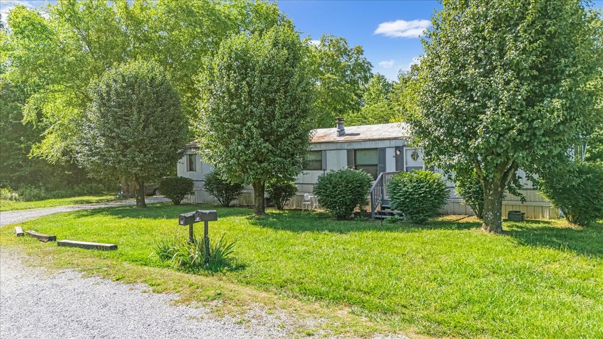 0 Ez Lane Manchester, TN 37355 - Photo 51 of 56 a view of a house with a yard and sitting area