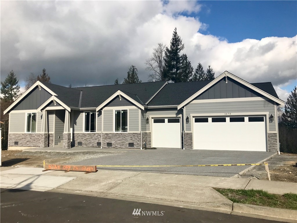 1670 Spaulding Circle Buckley, WA 98321 - Photo 1 of 22 a front view of a house with trees