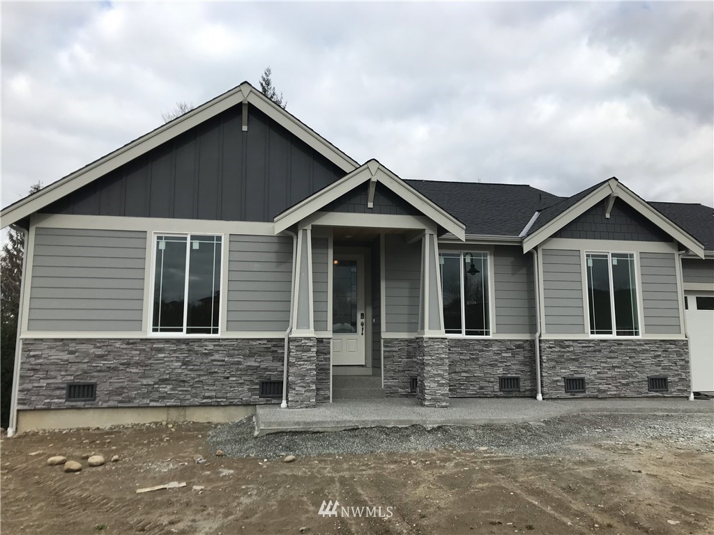 1670 Spaulding Circle Buckley, WA 98321 - Photo 2 of 22 a front view of a house with yard
