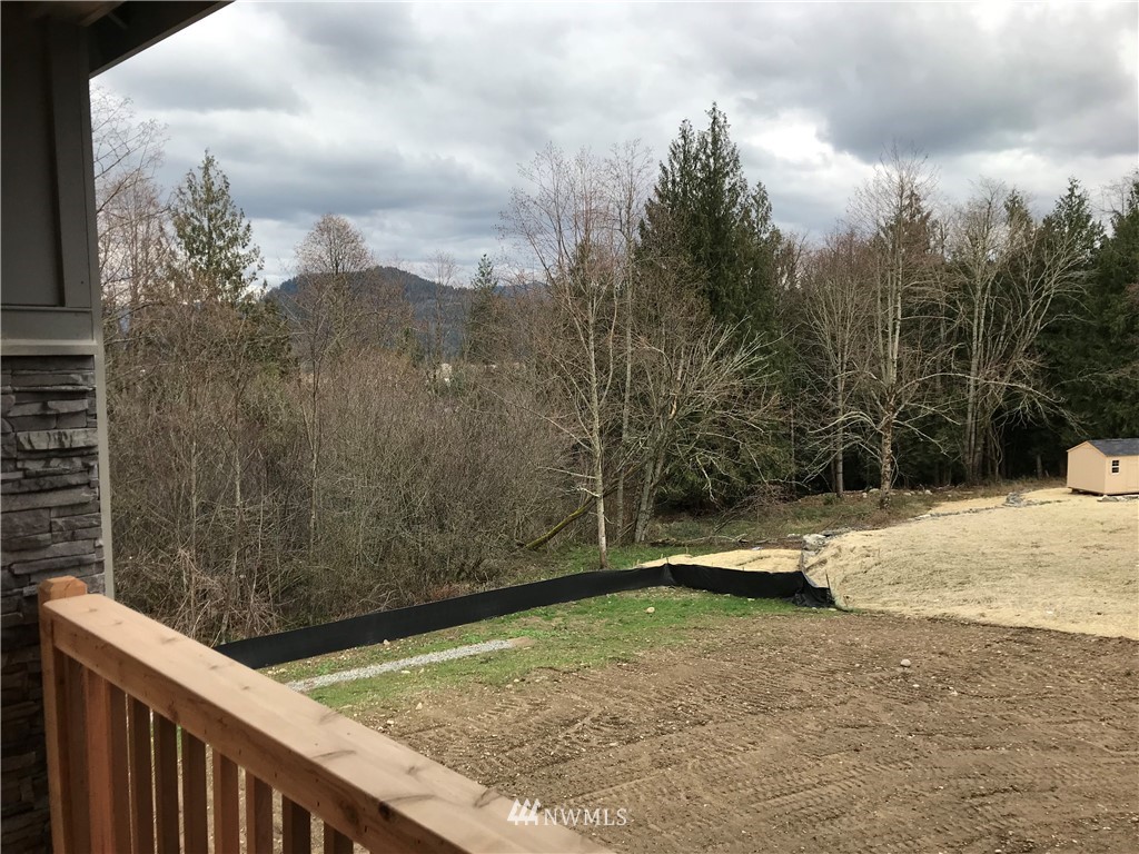 1670 Spaulding Circle Buckley, WA 98321 - Photo 11 of 22 a view of a backyard with wooden fence
