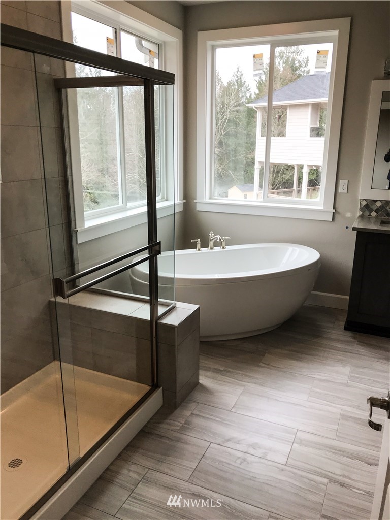 1670 Spaulding Circle Buckley, WA 98321 - Photo 13 of 22 a bathroom with a bathtub and a shower