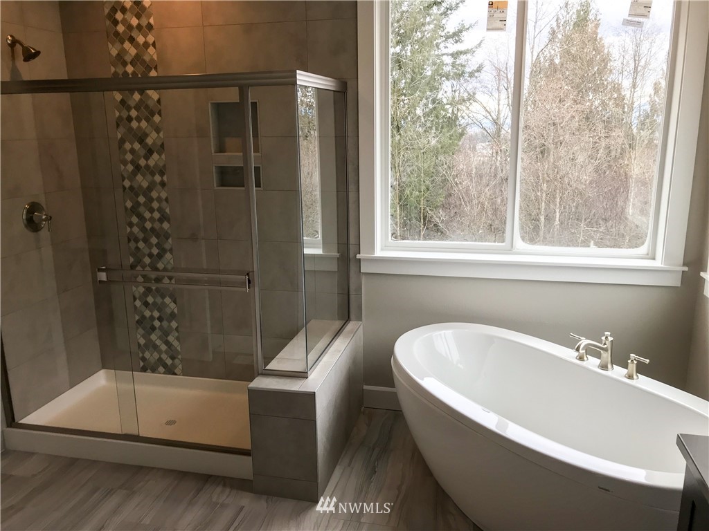 1670 Spaulding Circle Buckley, WA 98321 - Photo 15 of 22 a bathroom with a bathtub and shower