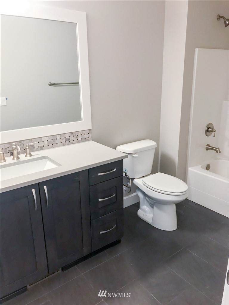 1670 Spaulding Circle Buckley, WA 98321 - Photo 16 of 22 a bathroom with a sink a toilet and shower