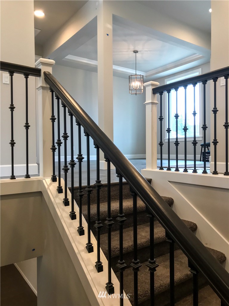 1670 Spaulding Circle Buckley, WA 98321 - Photo 17 of 22 a view of staircase with railing and a chandelier