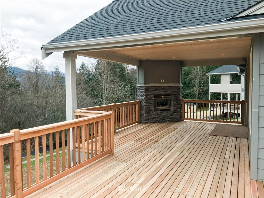 1670 Spaulding Circle Buckley, WA 98321 - Photo 8 of 22 a view of a wooden deck with a yard
