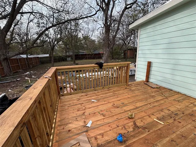 a view of wooden deck with a bench