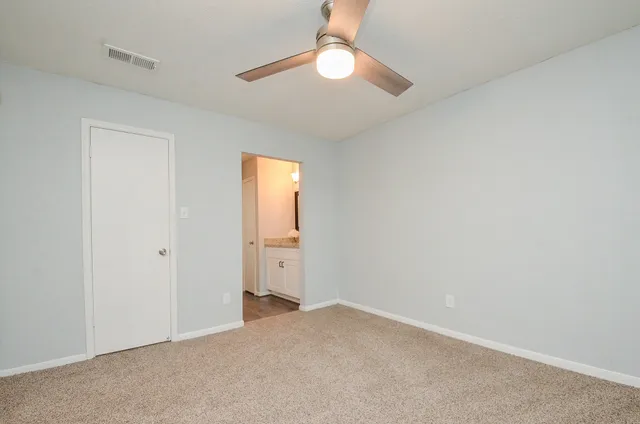 an empty room with a bathroom