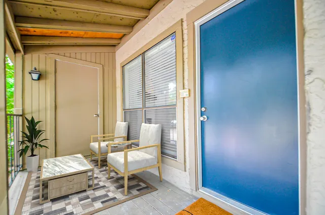 a living room with furniture and a window
