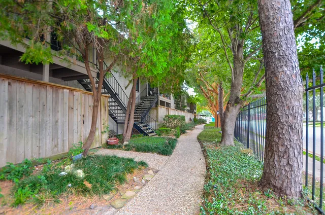 a view of a swimming pool and a yard