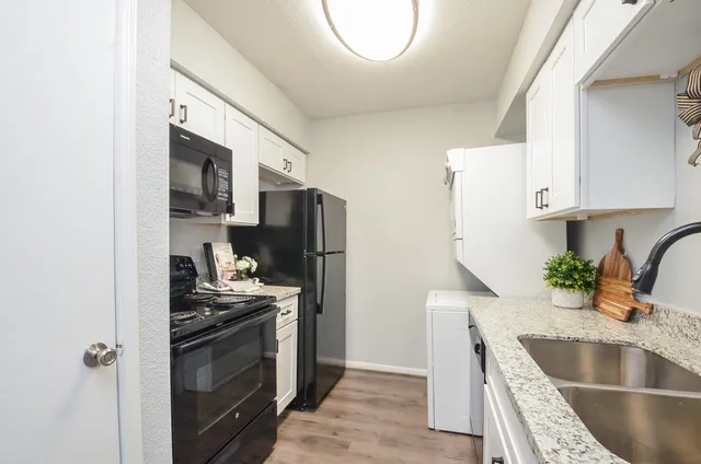 a view of a kitchen with a sink