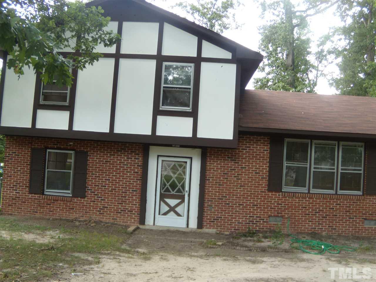 4201 Live Oak Road Raleigh, NC 27604 - Photo 1 of 17 a front view of a house with large windows