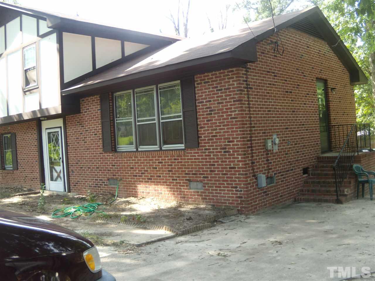 4201 Live Oak Road Raleigh, NC 27604 - Photo 2 of 17 a front view of a house with a yard