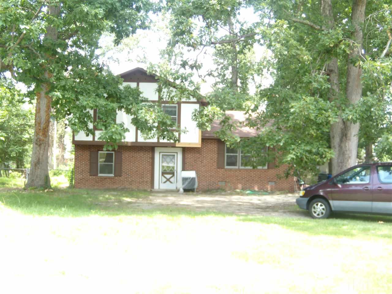 4201 Live Oak Road Raleigh, NC 27604 - Photo 13 of 17 a view of a house with a yard