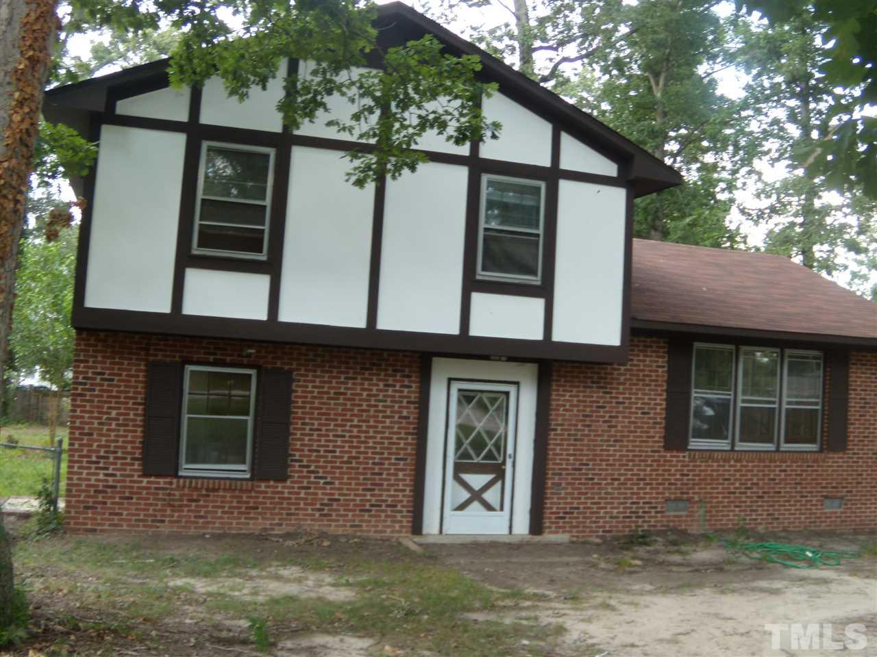 4201 Live Oak Road Raleigh, NC 27604 - Photo 15 of 17 a front view of a house with large windows