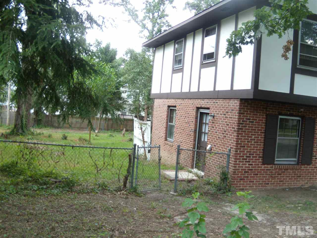 4201 Live Oak Road Raleigh, NC 27604 - Photo 16 of 17 a backyard of a house with lots of green space