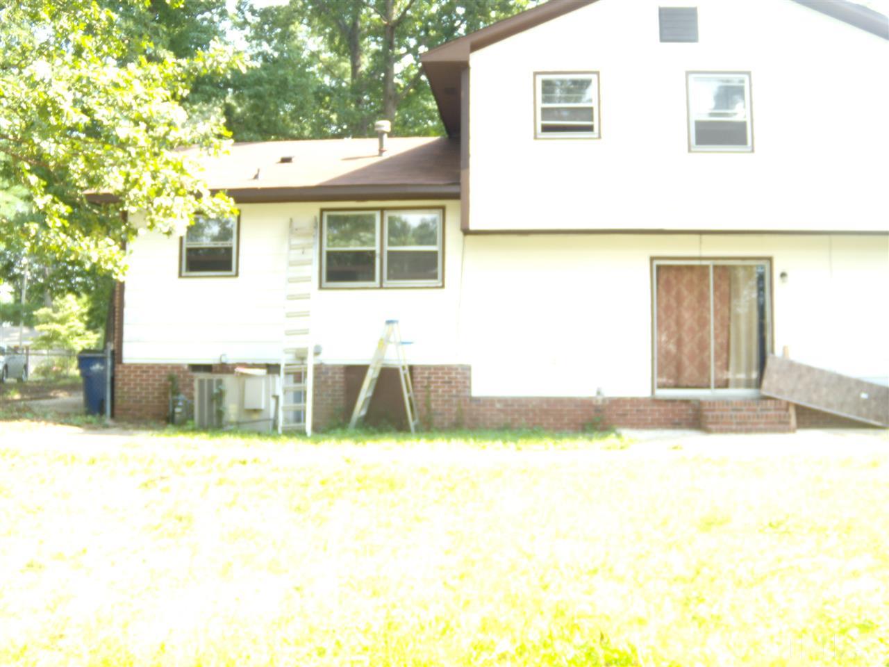 4201 Live Oak Road Raleigh, NC 27604 - Photo 5 of 17 a view of a house with pool and a yard
