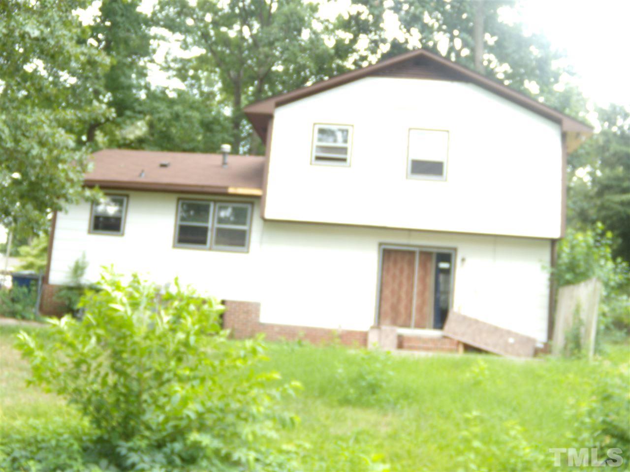 4201 Live Oak Road Raleigh, NC 27604 - Photo 8 of 17 a view of a house with a backyard