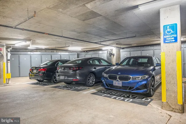 a view of a hallway with wooden floor and closet