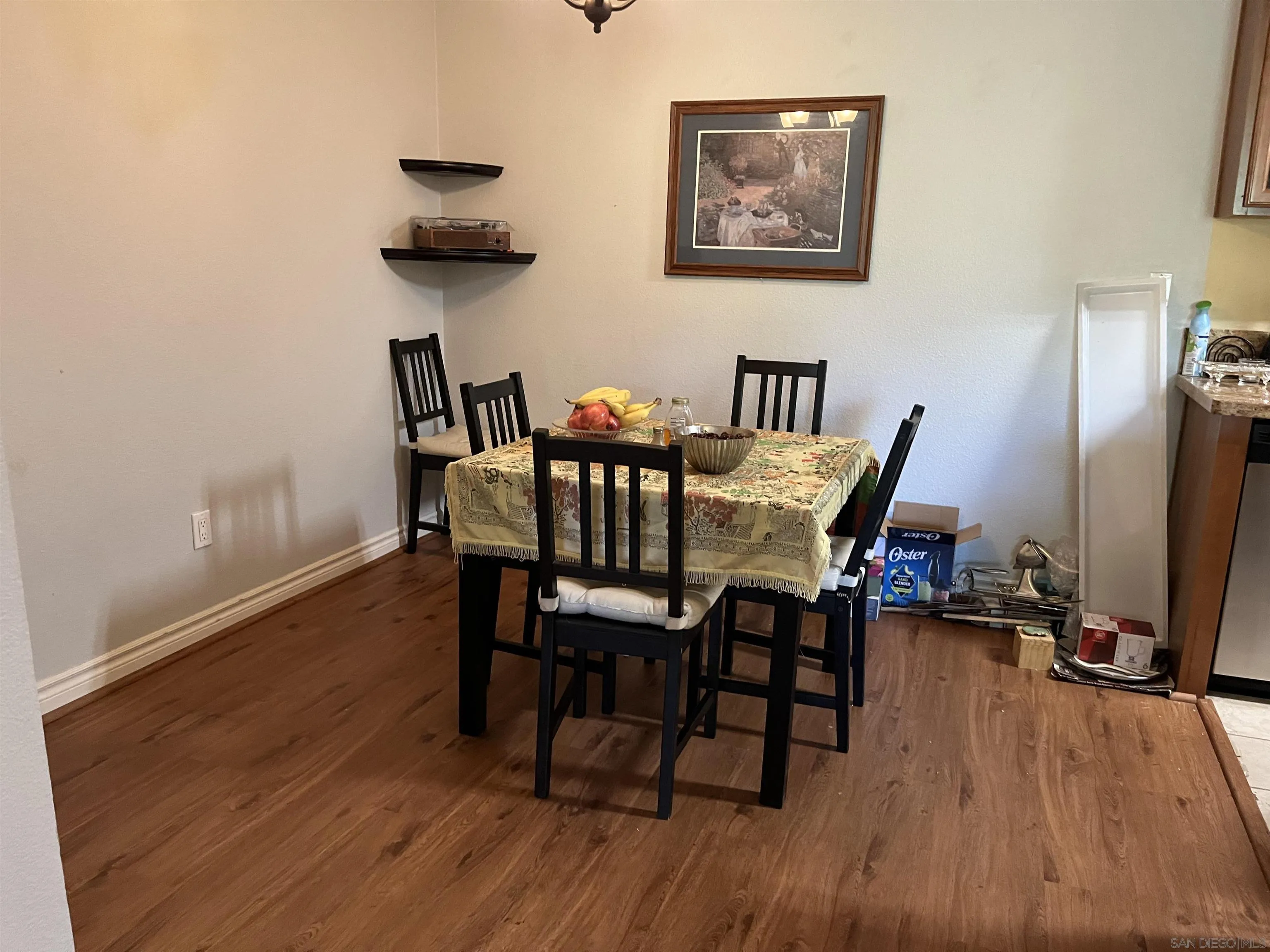 9929 Azuaga Street, Unit F 202 San Diego, CA 92129 - Photo 11 of 18 a view of a dining room with furniture and wooden floor