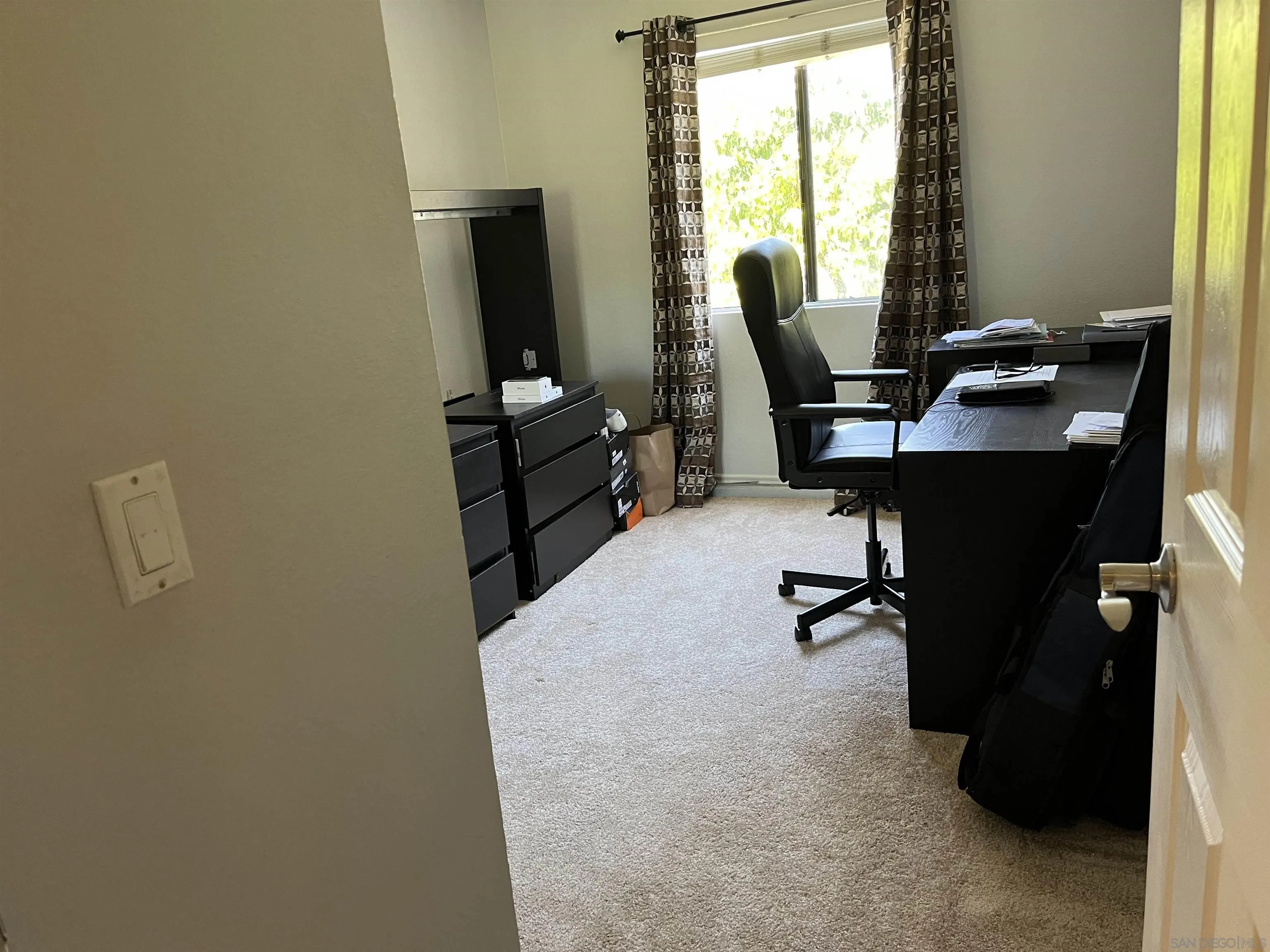 9929 Azuaga Street, Unit F 202 San Diego, CA 92129 - Photo 12 of 18 a view of a workspace with furniture and a window