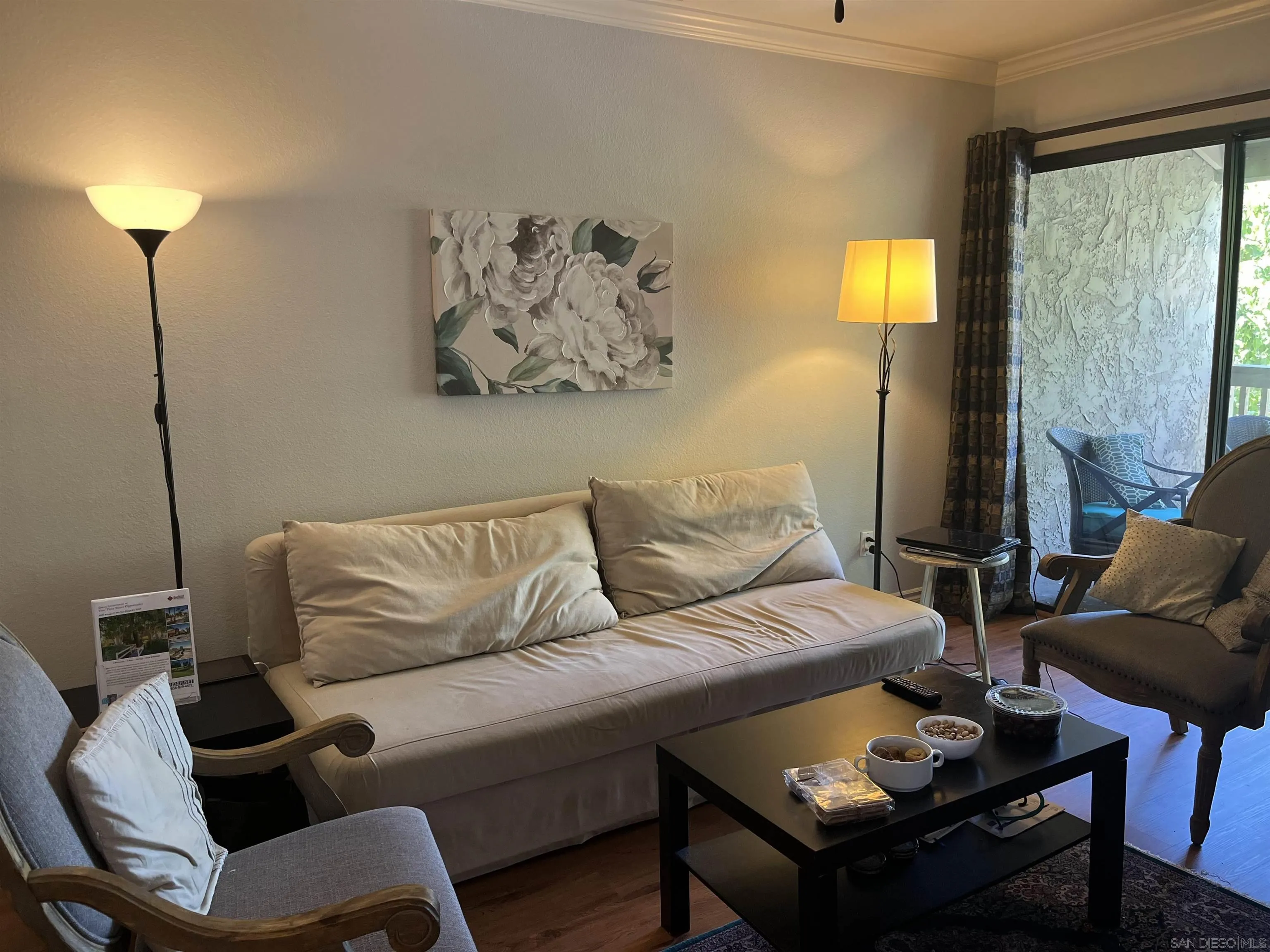 9929 Azuaga Street, Unit F 202 San Diego, CA 92129 - Photo 15 of 18 a living room with furniture and a lamp