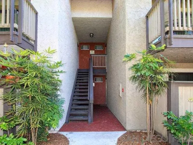 9929 Azuaga Street, Unit F 202 San Diego, CA 92129 - Photo 16 of 18 a potted plant sitting in front of a house
