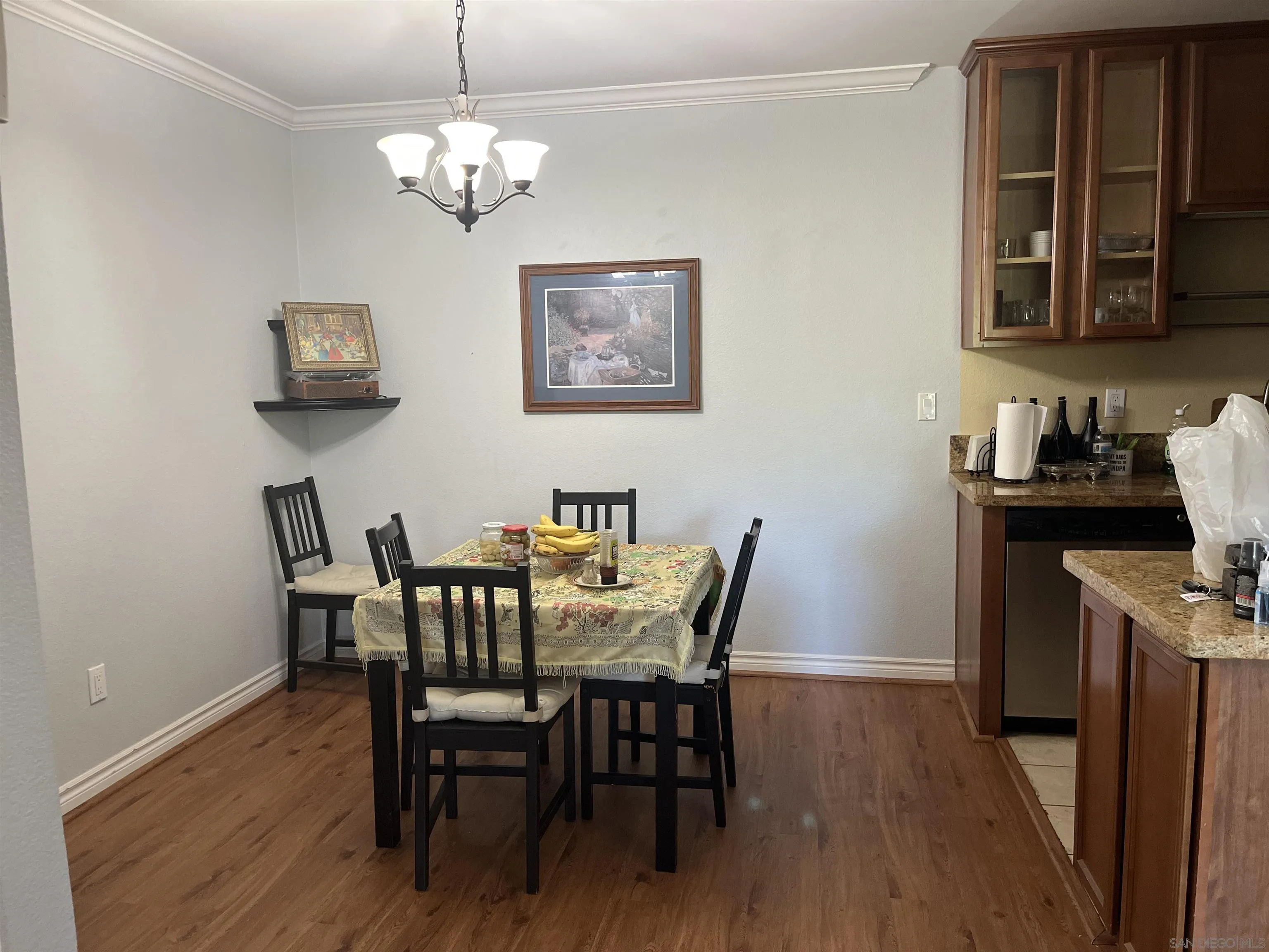 9929 Azuaga Street, Unit F 202 San Diego, CA 92129 - Photo 2 of 18 a view of a dining room with furniture and wooden floor