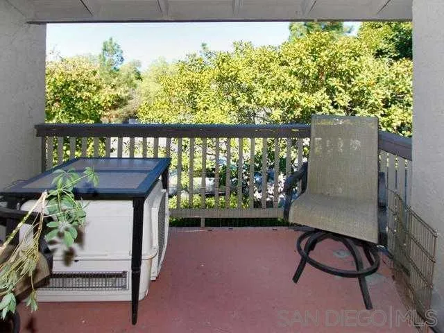 9929 Azuaga Street, Unit F 202 San Diego, CA 92129 - Photo 3 of 18 a view of balcony with wooden floor and outdoor seating