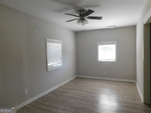 520 Old Athens Drive Nicholson, GA 30565 - Photo 10 of 13 a view of an empty room with a window and wooden floor