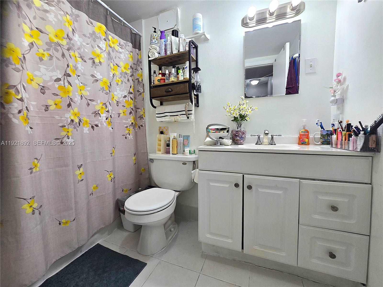 1750 West 56th Street, Unit 216 Hialeah, FL 33012 - Photo 7 of 14 a bathroom with a sink toilet and vanity