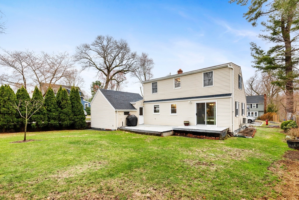 23 Houston Street Wakefield, MA 01880 - Photo 1 of 38 a white house that has a big yard in front of it