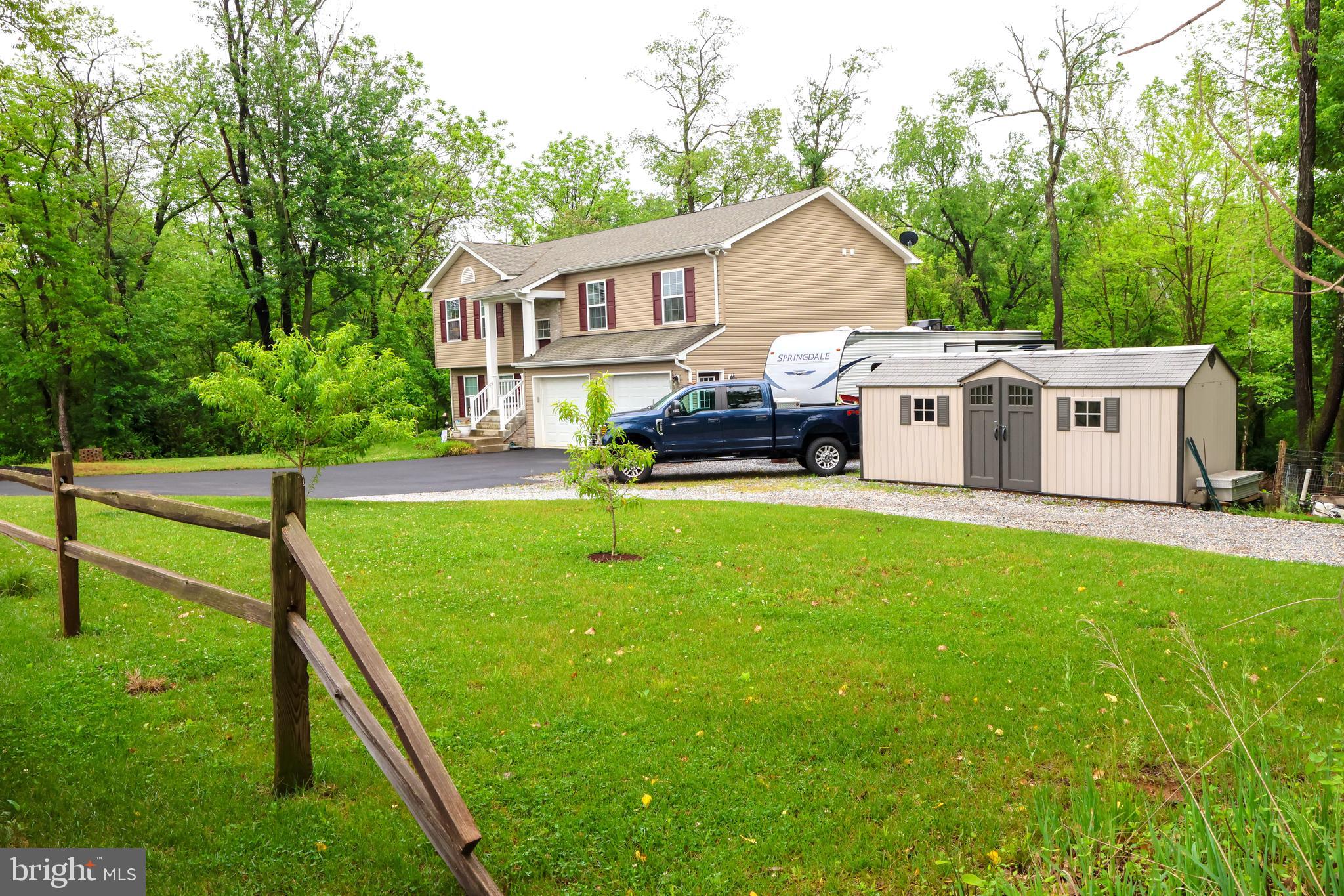 16919 Shaffer Road Sharpsburg, MD 21782 - Photo 55 of 58 a view of a house with a yard and sitting area