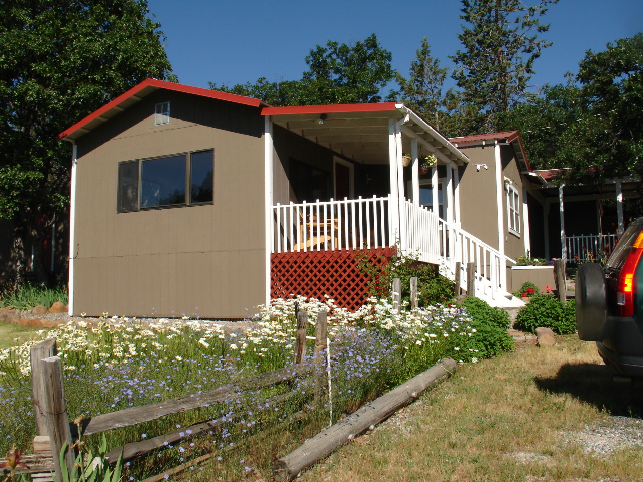 40624 Red Mountain Road Fall River Mills, CA 96028 - Photo 1 of 11 a front view of a house with a yard