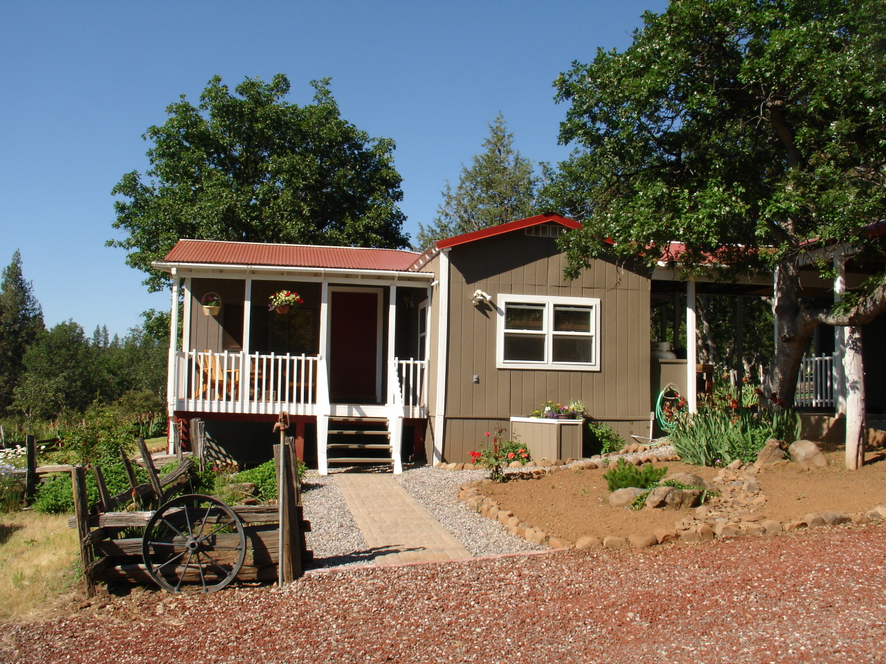 40624 Red Mountain Road Fall River Mills, CA 96028 - Photo 2 of 11 a front view of a house with a patio