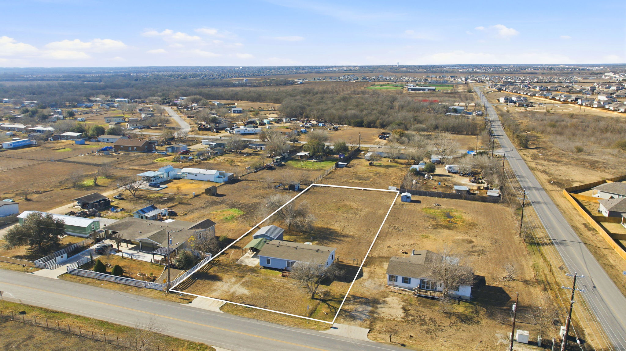 an aerial view of residential houses with outdoor space