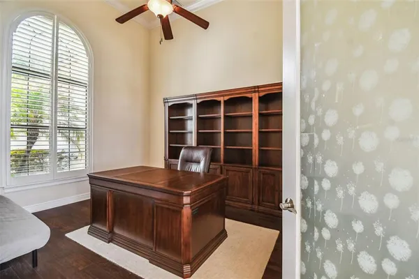 a bedroom with a bed and large window