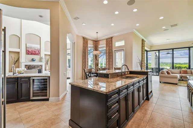 a view of a livingroom with wooden floor and furniture