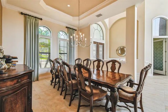 a spacious bathroom with a granite countertop tub and a large window