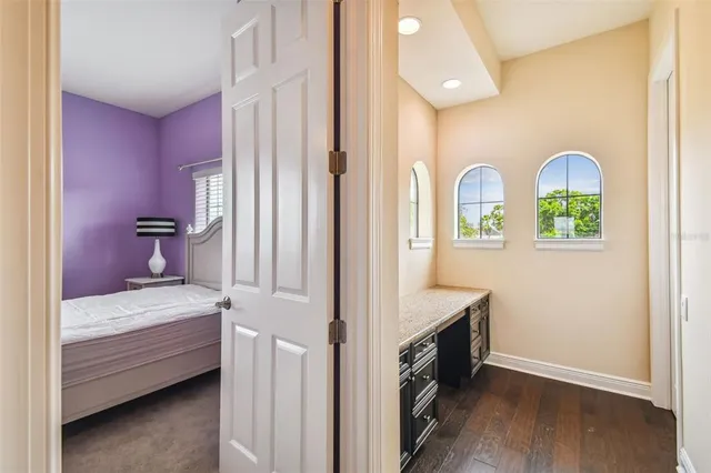 a view of a house with backyard porch and sitting area