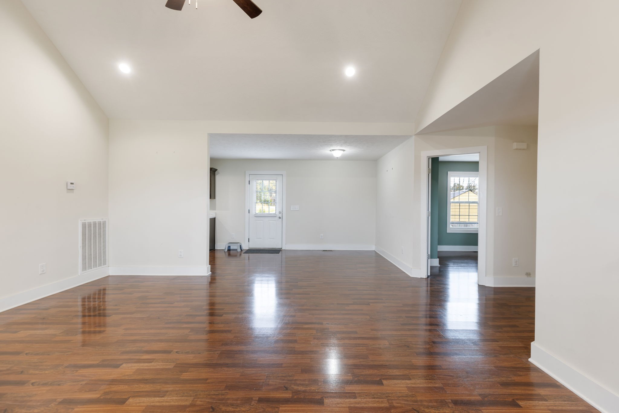 735 Belfast Farmington Road Lewisburg, TN 37091 - Photo 14 of 56 a view of an empty room with wooden floor and windows