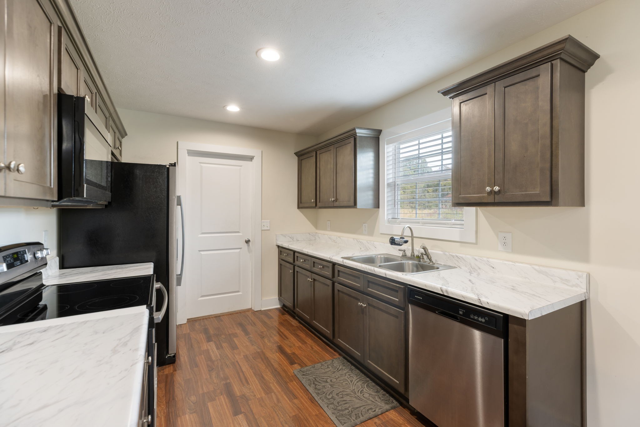 735 Belfast Farmington Road Lewisburg, TN 37091 - Photo 17 of 56 a kitchen with a sink stove and refrigerator