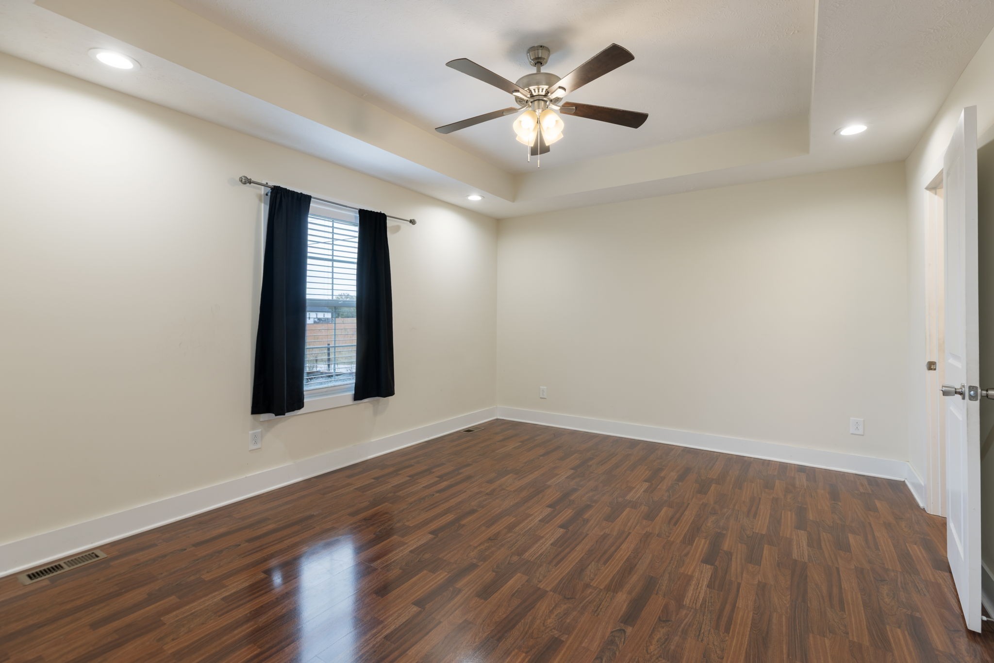735 Belfast Farmington Road Lewisburg, TN 37091 - Photo 23 of 56 an empty room with wooden floor and windows