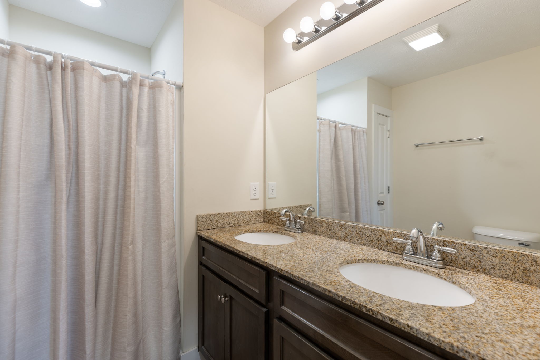 735 Belfast Farmington Road Lewisburg, TN 37091 - Photo 28 of 56 a bathroom with a granite countertop sink and a mirror