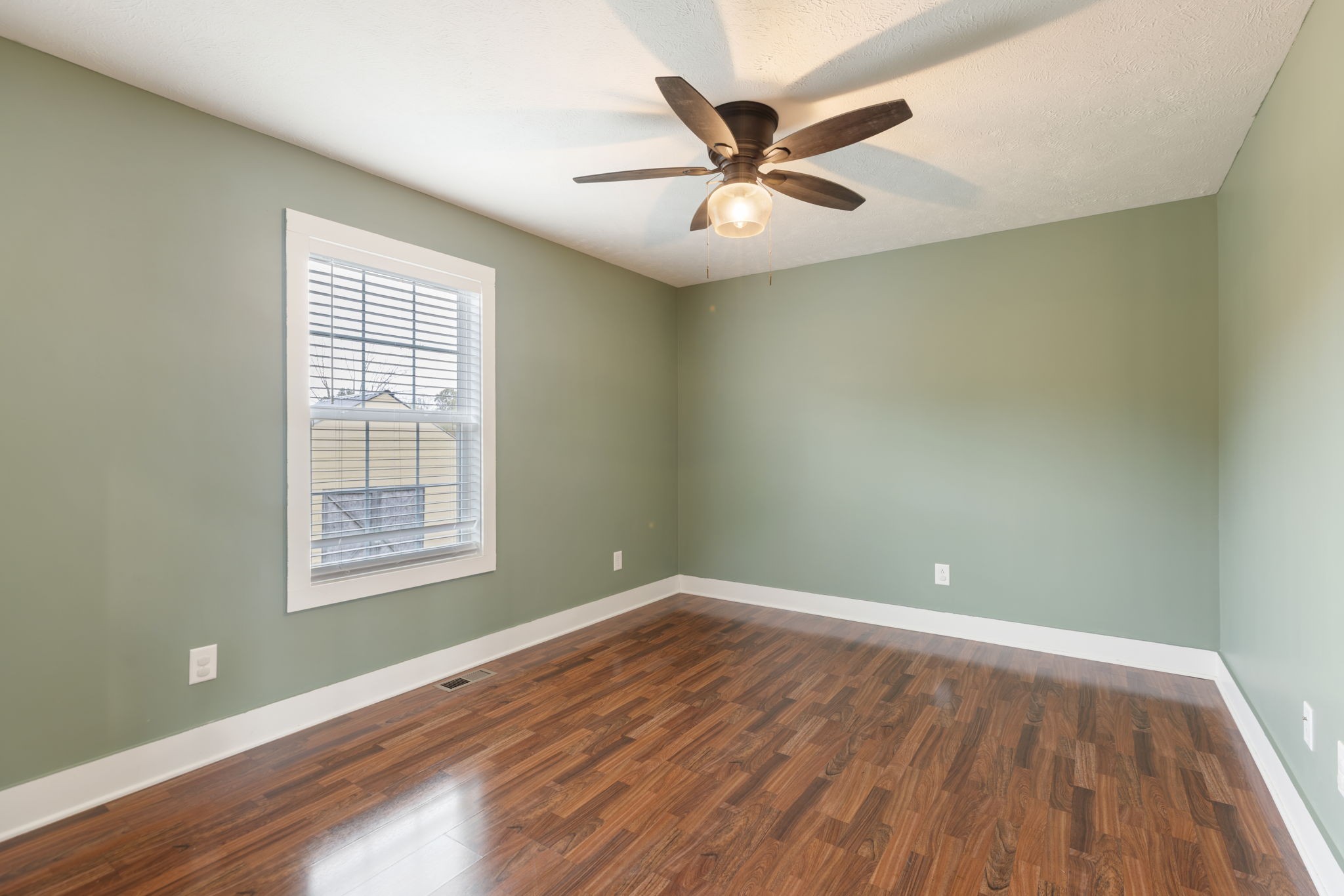 735 Belfast Farmington Road Lewisburg, TN 37091 - Photo 35 of 56 an empty room with wooden floor fan and windows
