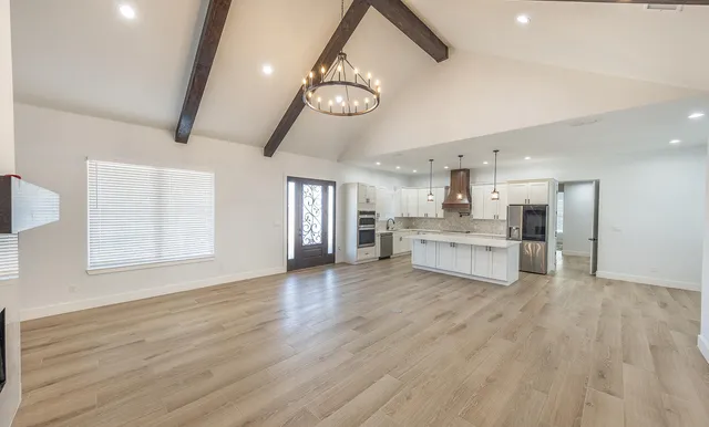a view of a kitchen with stove and cabinets