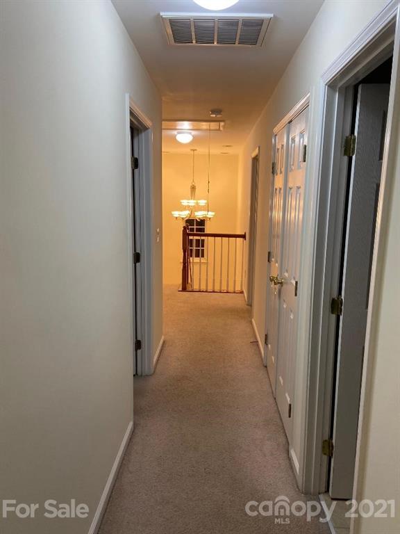 901 Cadogan Court Fort Mill, SC 29708 - Photo 16 of 33 a view of a hallway with a refrigerator