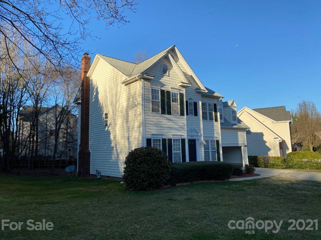 901 Cadogan Court Fort Mill, SC 29708 - Photo 3 of 33 a front view of a house with a garden