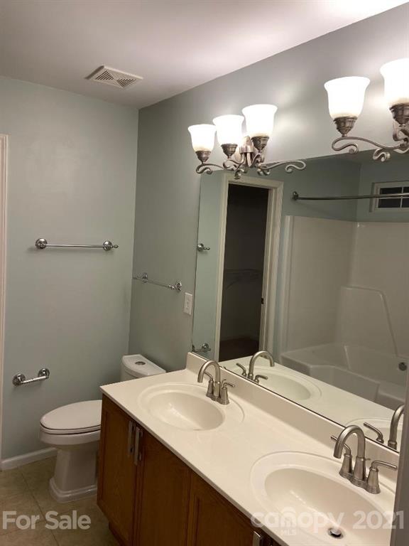 901 Cadogan Court Fort Mill, SC 29708 - Photo 30 of 33 a bathroom with a sink and a mirror