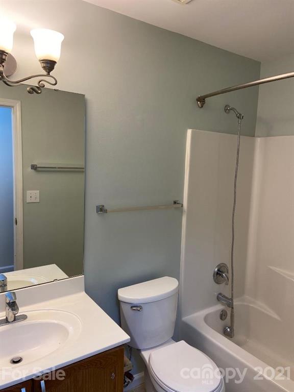 901 Cadogan Court Fort Mill, SC 29708 - Photo 32 of 33 a bathroom with a sink toilet and shower